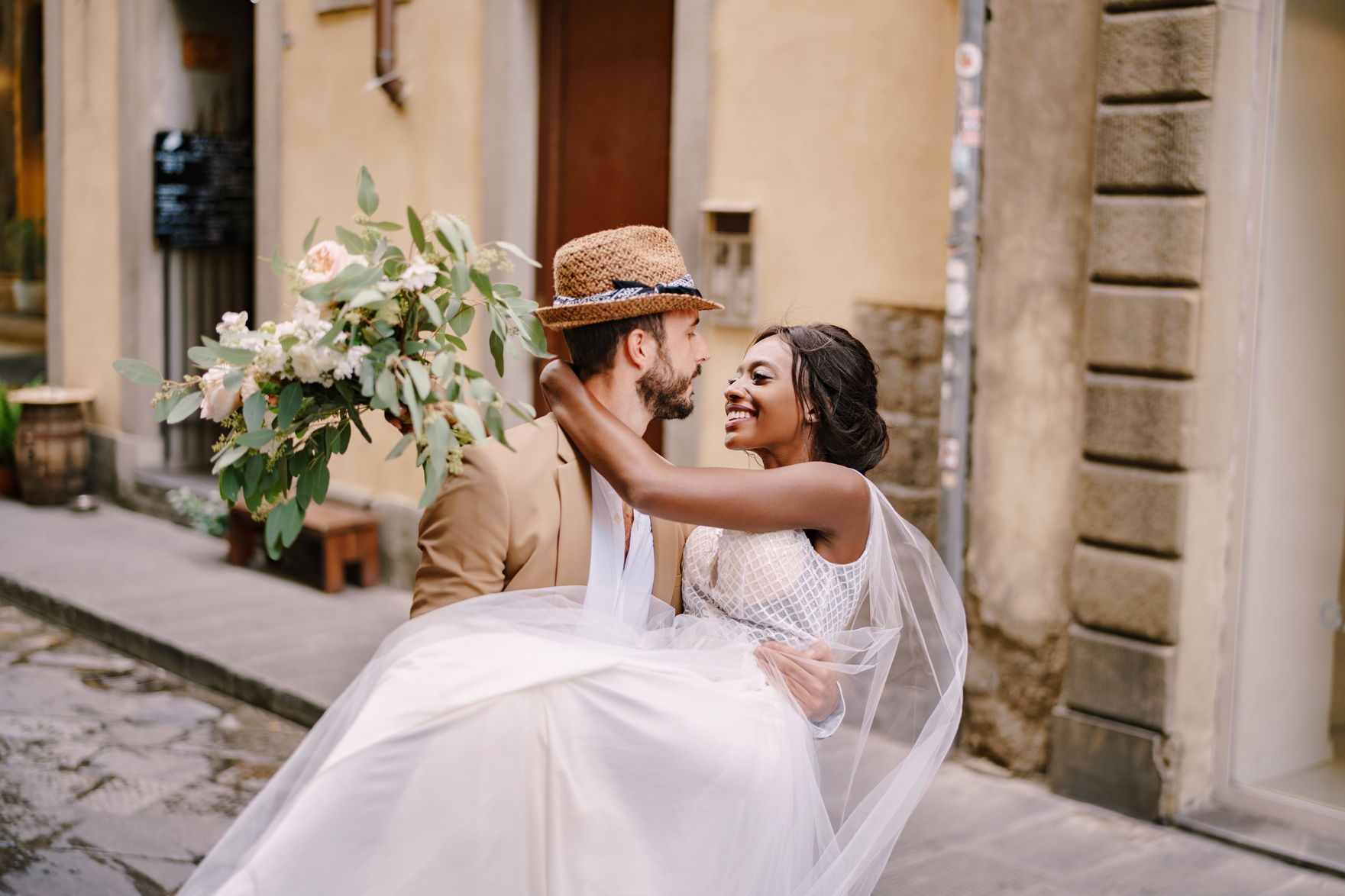 bride and groom hugging 